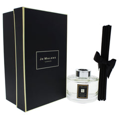 Jo Malone English Pear and Freesia diffuser decor enhances a refined room aroma