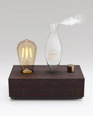 JOOSING glass diffuser with pinewood base for stylish, long-lasting fragrance in living spaces.