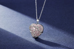 Jovivi leaf-wrapped design around rose quartz adds artisanal style.