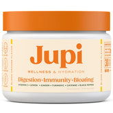 Jupi turmeric shot in a glass showing a refreshing citrus energy boost