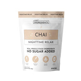 Just Ingredients Chai Nighttime Relax bottle beside a cozy mug for calm evenings.
