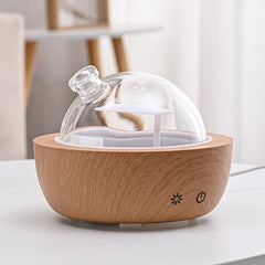 Kakoda hand-blown glass cover offers a unique decorative touch.