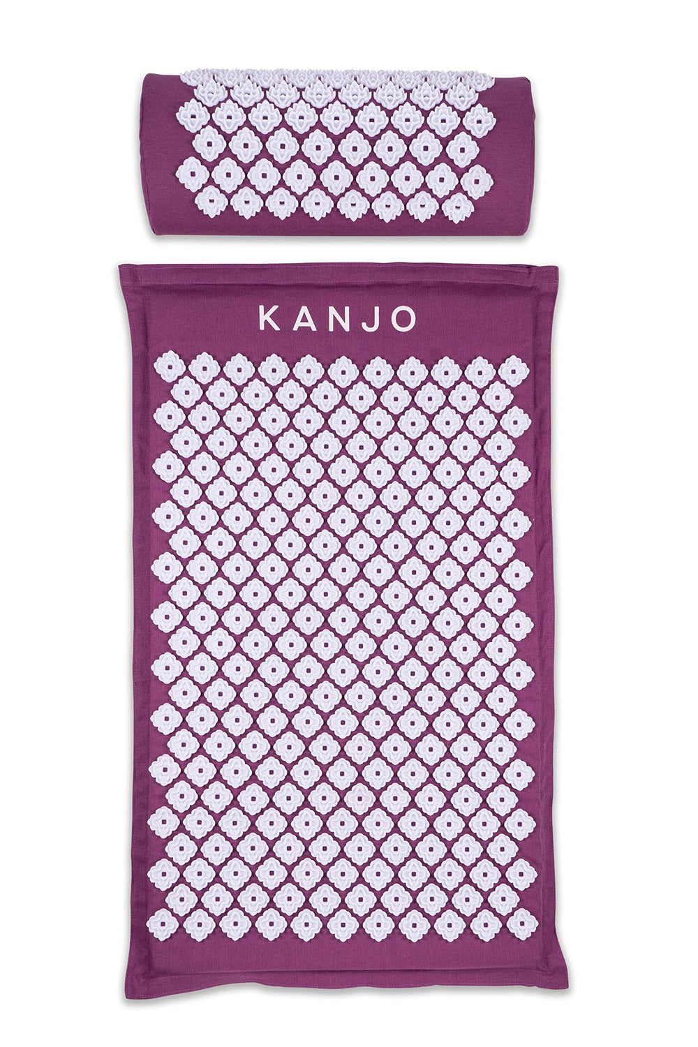 Kanjo acupressure mat in amethyst on bed, targeting back pressure points for relaxed muscles.
