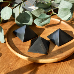 Karelian Heritage shungite pyramid on office desk for focus and balance.