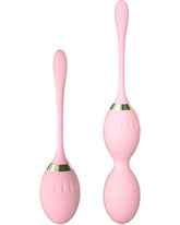 KIISAWA pink dual-sphere Kegel balls ready for pelvic floor engagement during daily activities.