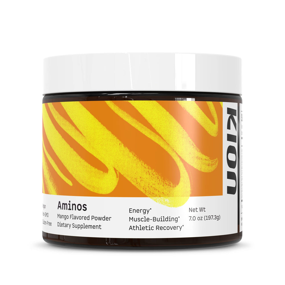 Kion Aminos Mango tub on counter shows caffeine-free amino boost for workouts.