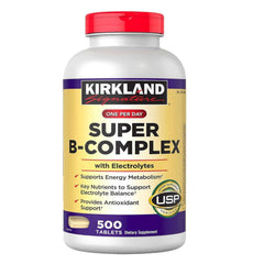 Kirkland Signature Super B-Complex with electrolytes bottle pouring, highlighting energy metabolism support