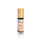 Kuumba Made Black Coconut fragrance oil roller bottle on a clean surface for lasting scent.