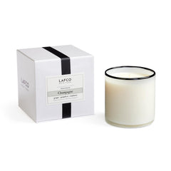 LAFCO New York Signature Champagne candle in a hand-blown vessel enhances ambient lighting.
