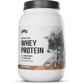 Levels Grass Fed Whey bottle on a kitchen counter showcasing clear packaging and label.