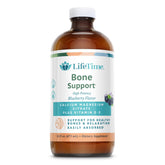 Lifetime Bone Support bottle being poured, highlighting easy absorption and blueberry flavor.