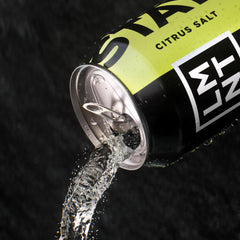 Athlete drinking LMNT Sparkling Citrus Salt during workout for rehydration.