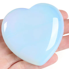 MAIBAOTA Opalite heart crystal in hand for emotional balance.