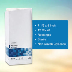 McKesson abdominal pads showing inner cellulose tissue for moisture management.