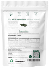 Micro Ingredients spirulina tablet being poured from bottle for daily use