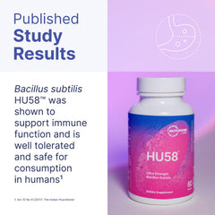 Capsules on wood surface suggest convenient daily probiotic for digestive comfort.