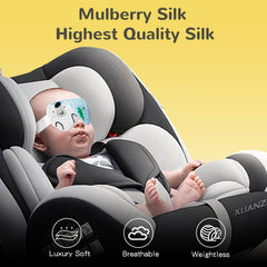 Mini Nomad silk sleep mask blocks light with plush padding, gentle on hair
