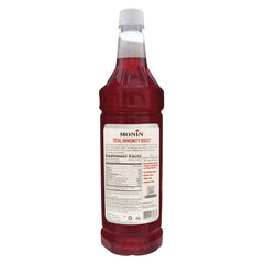 Monin Total Immunity Boost label close-up highlighting sustainable packaging.
