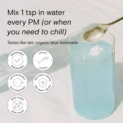 Moon Juice Magnesi-Om Blue Lemon Stick dissolving quickly in a glass.