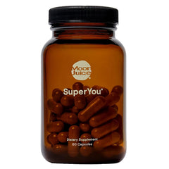 Moon Juice SuperYou bottle on a clean surface, suggesting calm energy for busy mornings.