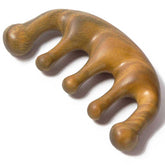 Moreinday wooden massage comb with green sandalwood handle for soothing scalp massage.