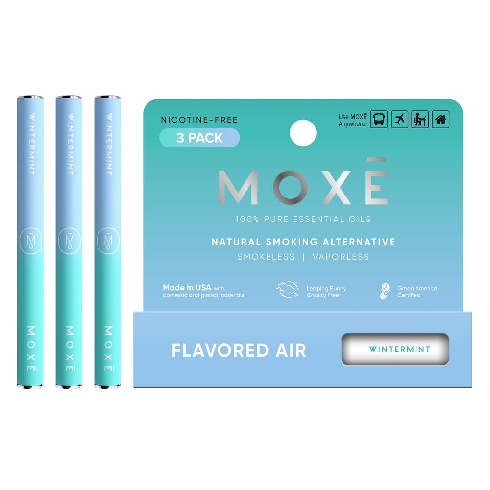 MOXE Wintermint air inhaler compact in hand for quick refreshing aroma on the go.