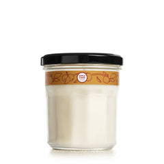 Mrs. Meyer's Apple Cider candle in a close-up jar for a cozy fall aroma.