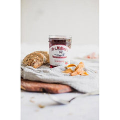 Mrs. Miller's Cranberry Jelly being spread on toast, a classic breakfast option