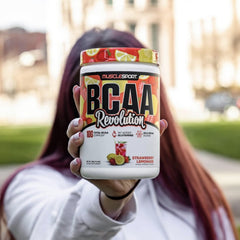 Musclesport BCAA Revolution scoop dispensing powder for precise measurement.
