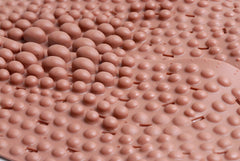 Nature In Hand red clay loess insoles in use during walking provide subtle support.