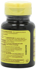 Zinc 30mg bottle beside water for daily routine.