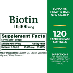 Nature's Bounty Biotin 10000 mcg packaging on kitchen counter suggests daily wellness.