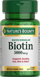 Nature's Bounty Biotin quick-dissolve tablet close-up, highlighting energy metabolism and hair support.