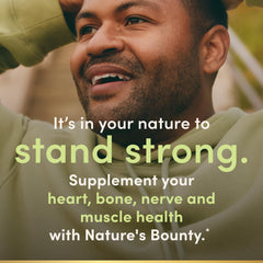 Nature's Bounty Magnesium 400 mg softgel capsules in hand for on-the-go use