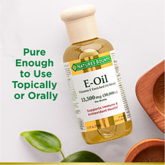 Nature’s Bounty Vitamin E Oil label highlighting ingredients and vegetarian suitability.