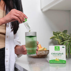 Glass of Nature's Sunshine chlorophyll drink ready for a light, refreshing boost.
