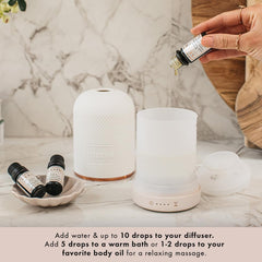 NEOM sandalwood essential oil bottle inviting grounding calm during routines.