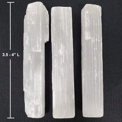 New Age Imports selenite sticks arranged in a grid for meditation and focus