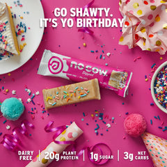 No Cow Birthday Cake bar with sprinkles featured as a convenient gym-friendly snack.