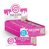 No Cow upgraded birthday cake bar pack on shelf provides steady energy with 20g plant protein.