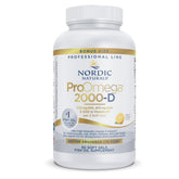 Nordic Naturals ProOmega 2000-D lemon bottle on kitchen counter for daily omega-3 support.