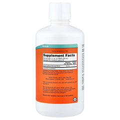 NOW Foods Colloidal Minerals bottle pour demonstrates easy daily dosing into juice or water.