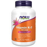 NOW Foods Vitamin K-2 250 bottle on table with capsules for bone support