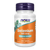 NOW Foods selenium tablet close-up showing a compact, yeast-free daily supplement.