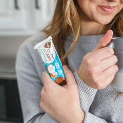 Cross-section reveals chocolate coating and coconut interior for rich texture