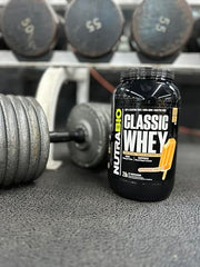 NutraBio Classic Whey scoop highlighting 25g protein per serving