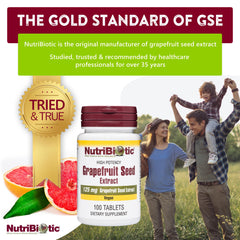 Close-up of NutriBiotic GSE tablets ready to swallow with water.