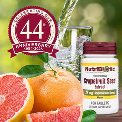 Tablets beside grapefruit illustration hint at natural origins for wellness.