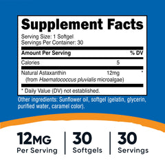 Close-up of Nutricost Astaxanthin capsule showing smooth softgel.