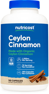 Nutricost Organic Cinnamon capsules bottle sits on a kitchen counter for daily supplementation.